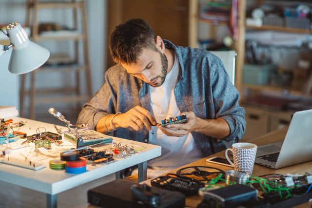 Picture of a person repairing an object