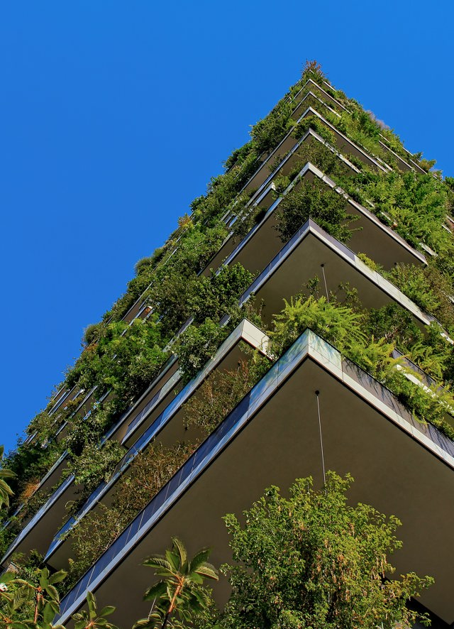 Apartment building with green balconies by Ricardo Gomez