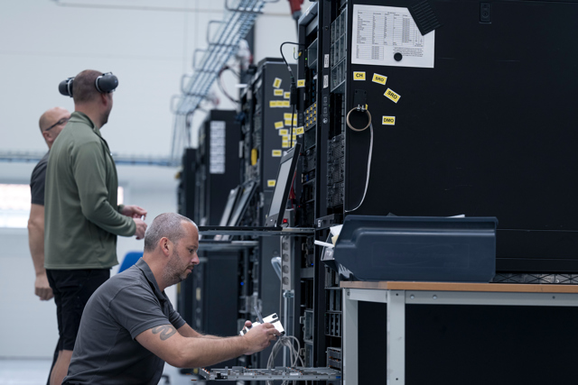 Technitians collaborating on the server refurbishing